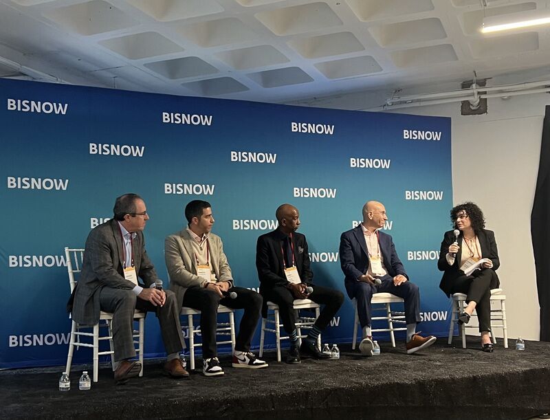 color photo of panel at Bisnow State of the Market Conference moderated by Danielle Ash